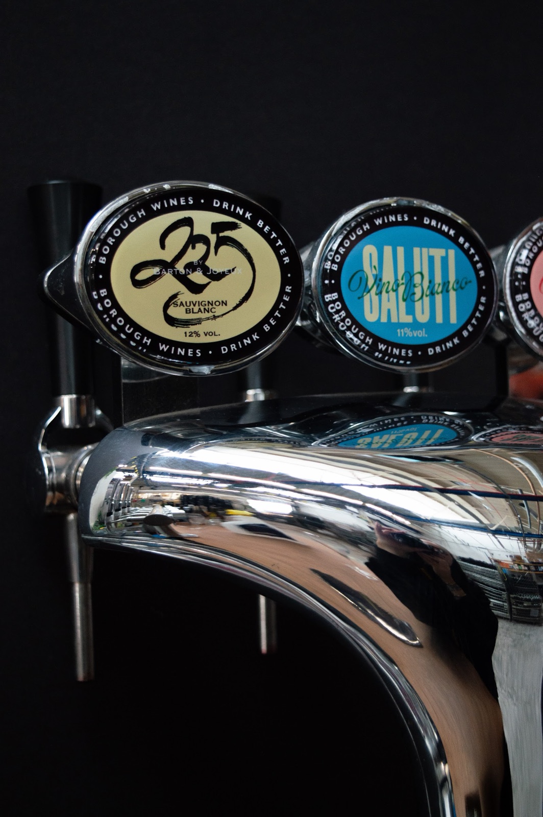 The chrome tap font with Borough Wines badges, including 235 Sauvignon Blanc and Salut Vino Bianco, each reading Drink Better.